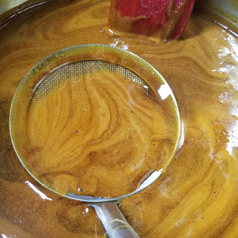 skimming the Rox Orange Sorghum syrup during boil