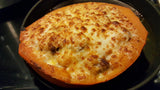 Lakota Squash - baked and stuffed with rice and chorizo, topped with cheese