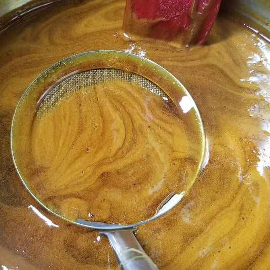 skimming the Rox Orange Sorghum syrup during boil