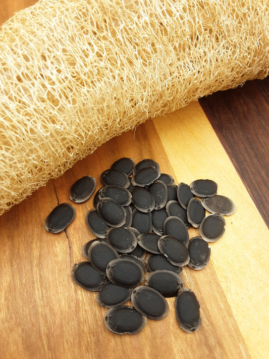 Fresh luffa gourd sponge with its black seeds